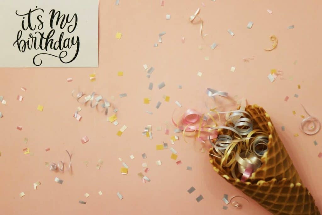 birthday confetti and invitation