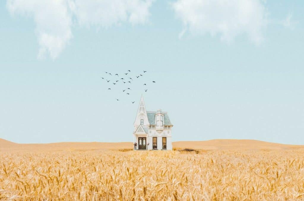 surreal photograph house in field